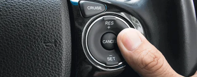Cruise control buttons on a steering wheel